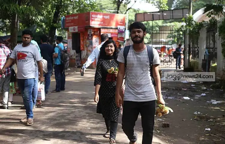 Flower lovers carry away kadam flowers they have bought. Photo: Mahbub Alam
