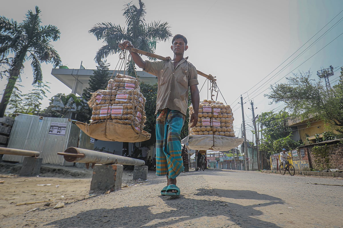Khalid Molla has brought flattened-rice and puffed-rice moa from Faridpur to sell in Khulna. BIWTA launch ghat, Khulna, 28 September. Photo: Saddam Hossain