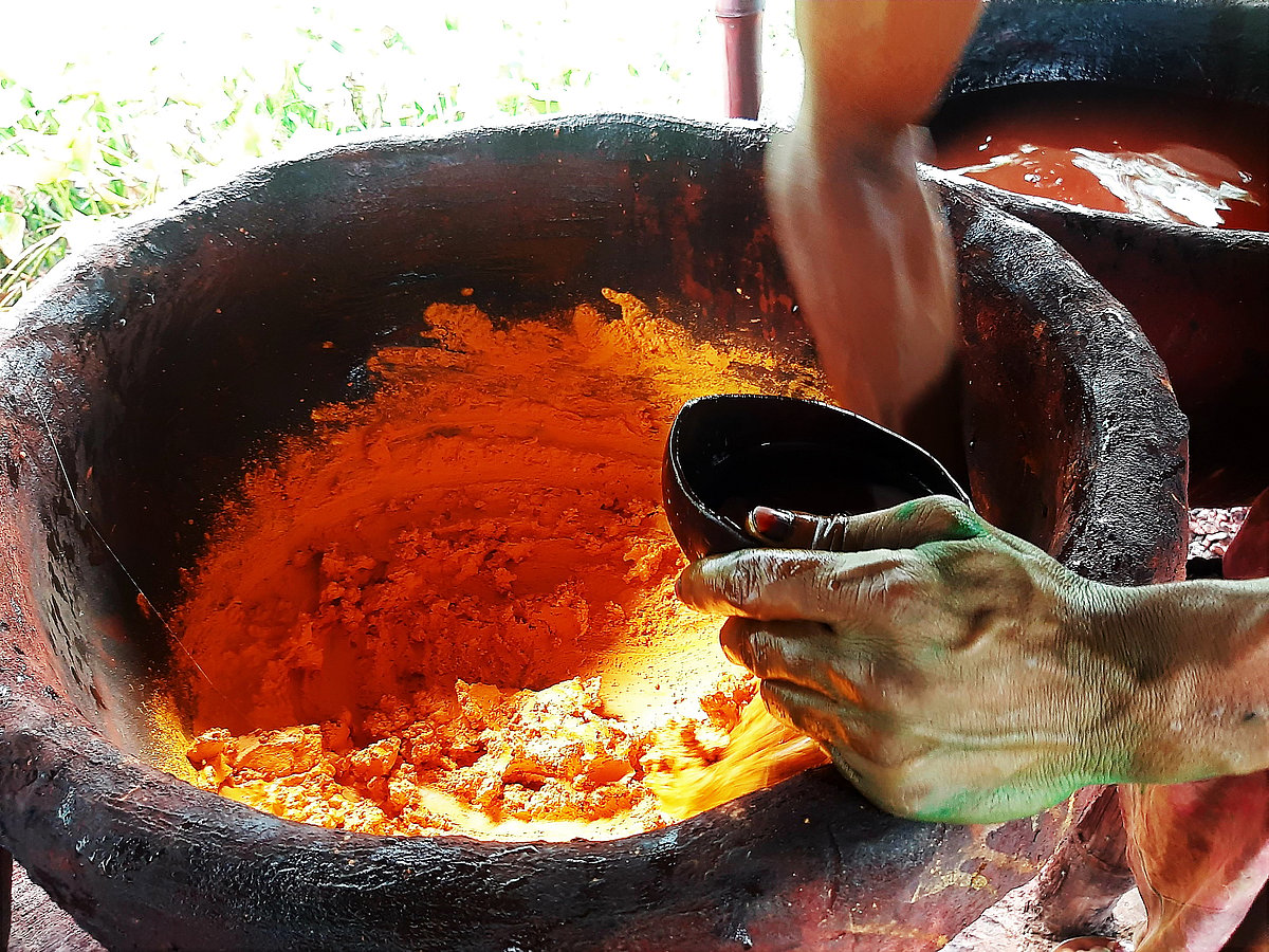 A worker mixes dye.